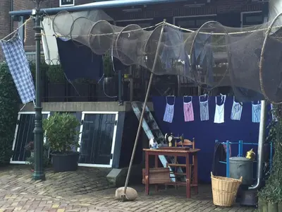 awning over a table with socks hanging from it at Holiday in Spakenburg t Afferhuus in Spakenburg