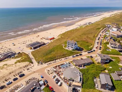 an aerial view of a beach and the ocean at Beach house Alba in Bergen aan Zee