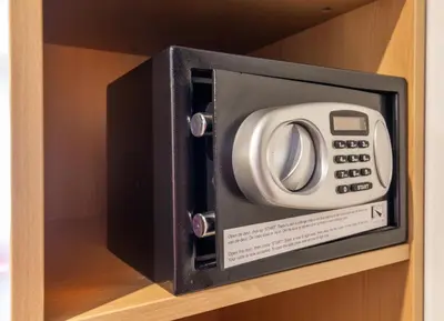 a microwave oven sitting on top of a shelf at Bastion Hotel Schiphol Hoofddorp in Hoofddorp