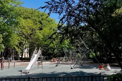 a park with children playing on a slide at Hotel de Munck in Amsterdam
