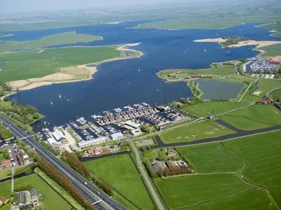 an aerial view of a river and a city at Holiday Home De Meerparel by Interhome in Uitgeest