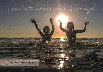 two girls in the water with the sun in their hands at Have a nice stay! - De Pottenbakkerij in Noordwijk