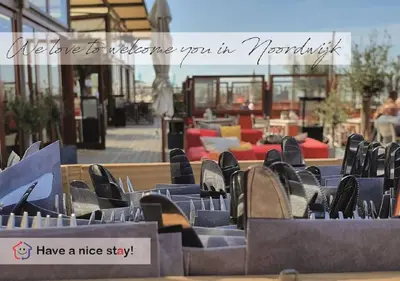 a group of chairs sitting in front of a patio at Have a nice stay! - Vakantiehuis 't Klavertje in Noordwijk