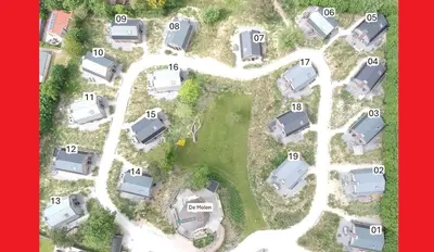 an aerial view of a parking lot with parked cars at Villa Zon & Duin in Egmond aan den Hoef