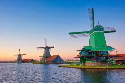 a group of windmills in the water at Amsterdam Edge Haven in Purmerend