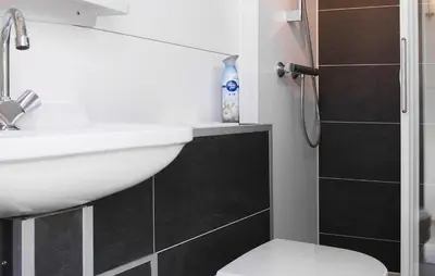 a bathroom with a sink and a toilet and a shower at Jack Sparrow in Almere