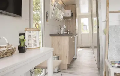a kitchen with a counter and a sink in a room at Blackbeard in Almere