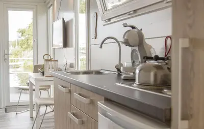 a kitchen with a sink and a counter top at Barbossa in Almere