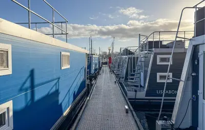 a train station with two trains parked next to each other at Johannesburg in Naarden