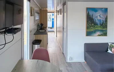 a living room with a couch and a table at Johannesburg in Naarden