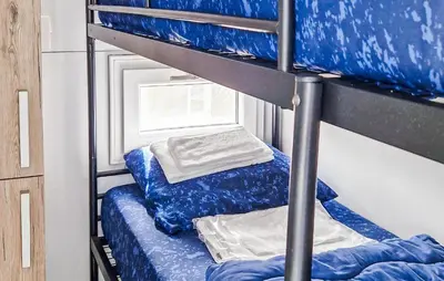 a couple of bunk beds in a room at Johannesburg in Naarden