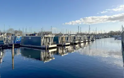 a group of boats docked in a marina at Sydney in Naarden