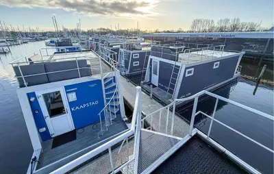 a group of boats docked at a marina at Amsterdam in Naarden