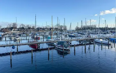 a bunch of boats docked in a harbor at New York in Naarden