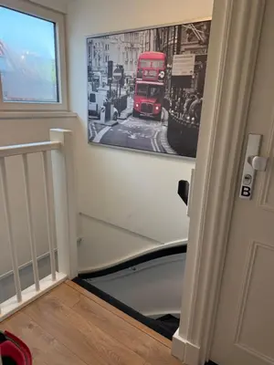 a hallway with a picture of a double decker bus on the wall at Tante Bed 44 B in Voorschoten