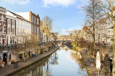 a river in a city with buildings next to a canal at Beautiful canal apartment in Utrecht for 4 persons in Utrecht