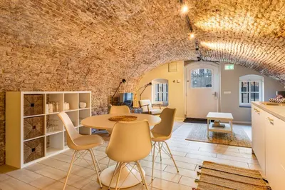 a kitchen and dining room with a table and chairs at Luxurious canal apartment in Utrecht A Location in Utrecht