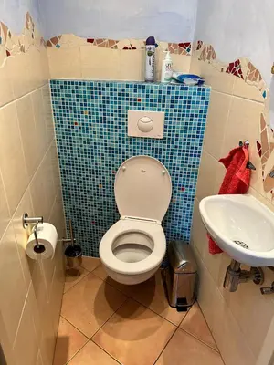 a bathroom with a toilet and a sink at Homestay Room in Utrecht