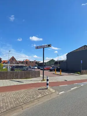 a street sign on the side of a road at Have a nice stay! - Juul's Rooftop, free parking in Noordwijk