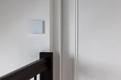 a clock on a wall next to a door at Maison Hans in Loenen aan de Vecht