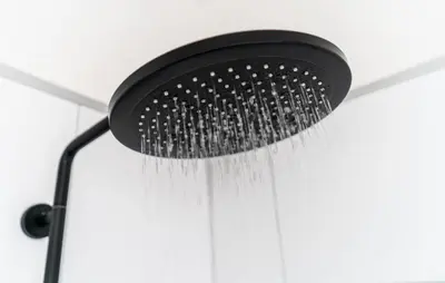 a black shower head hanging from a ceiling at Beautiful Home In Vinkeveen With Sauna in Vinkeveen