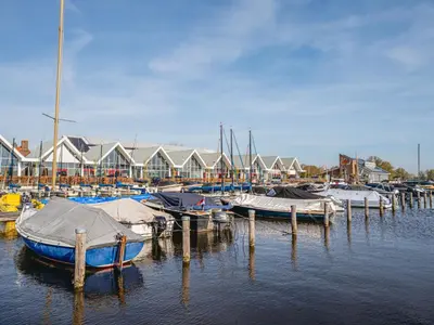 a group of boats docked at a marina at Apartment Westergeest 2 by Interhome in Uitgeest