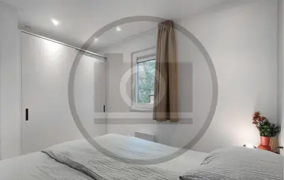 a bedroom with a circular mirror on the wall at Stunning Home In Vinkeveen With Sauna in Vinkeveen