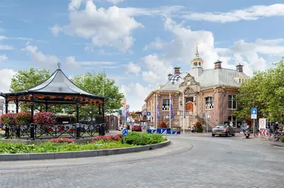 a gazebo on a street in front of a building at Seebrise Apartment with parking in Zandvoort