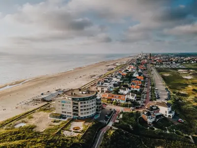 an aerial view of a beach and a city at Studio Elysium in Zandvoort