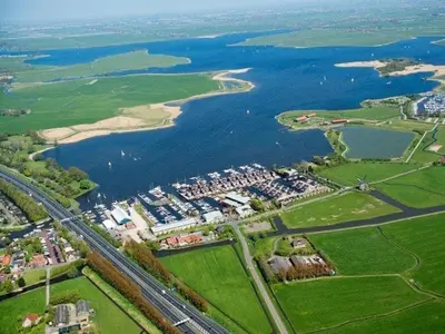 an aerial view of a city and a river at Houseboat Uitgeest in Uitgeest