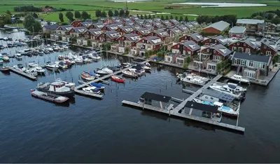 an aerial view of a marina with boats in the water at Houseboat Plus Uitgeest in Uitgeest