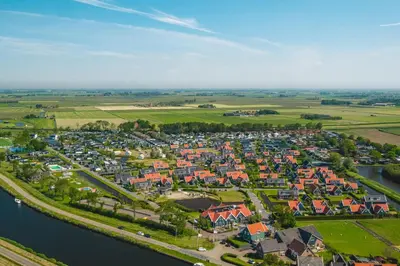 an aerial view of a town next to a river at De Beemster | Group accommodation near Amsterdam in West-Graftdijk