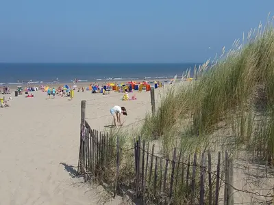 a beach with a lot of people on it at Holiday Home in Noordwijk near Beach in Noordwijk