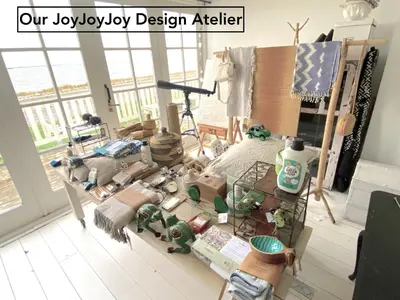 a room with a table filled with lots of toys at Your a Royalty - Equal Design by JoyJoyJoy - Top Floor and Top Views - Creating houses for the poor in Amsterdam