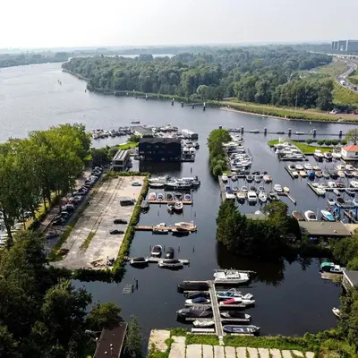 an aerial view of a marina with boats in the water at Motorjacht Flint in Amsterdam