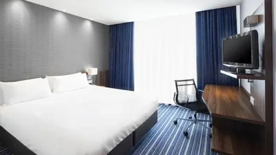 a hotel room with a bed and a tv at Holiday Inn Express Amsterdam - South by IHG in Amsterdam