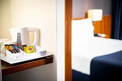 a hotel room with a table with a box of products at Holiday Inn Express Utrecht - Papendorp by IHG in Utrecht