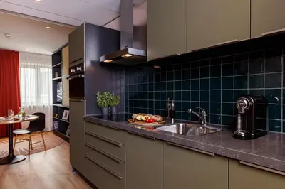 a kitchen with a sink and a counter top at Boutique Apartments Amsterdam in Amsterdam
