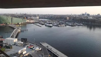 an aerial view of a harbor with boats in the water at Nachtwacht Apartment in Amsterdam