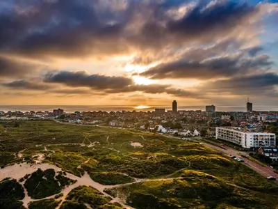an aerial view of a city at sunset at Amsterdam Beach in Zandvoort