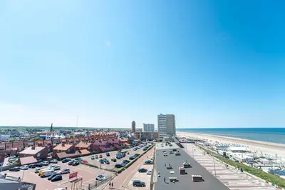 an aerial view of a beach with cars parked at Studio 4 u with private parking in Zandvoort