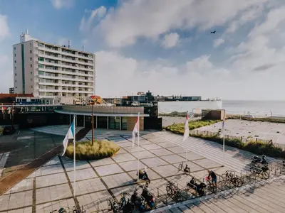 a group of bikes parked on a sidewalk near the beach at Amsterdam Beach Zandvoort Studio s in Zandvoort