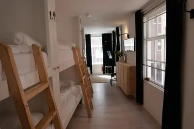 a hallway with two bunk beds in a room at Tiny Private City Rooms Haarlem in Haarlem