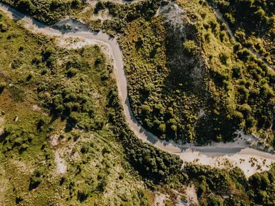 an aerial view of a road in the forest at Studio Pit-Stop in Zandvoort