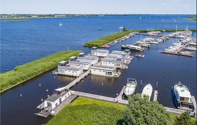 an aerial view of a marina with boats in the water at D'azur in Aalsmeer