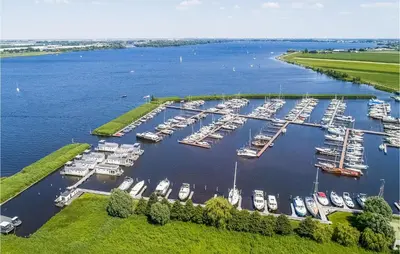 an aerial view of a marina with boats in the water at Nice Ship In Aalsmeer With Kitchen in Aalsmeer