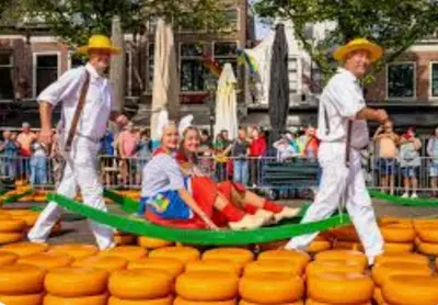 a group of men pulling a man in a raft at Huisje Finn, met grote tuin en veel privacy in Dirkshorn