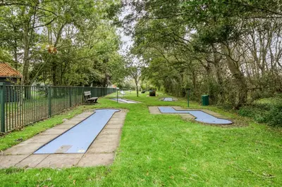 a row of tramp trays in a park at Rekerlanden 257 in Schoorldam