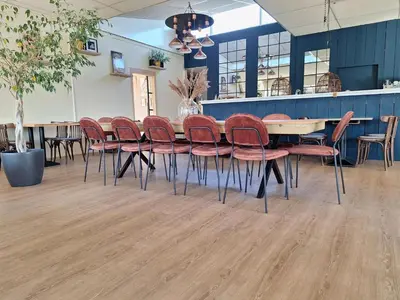 a dining room with a table and chairs at Rekerlanden 195 in Schoorldam