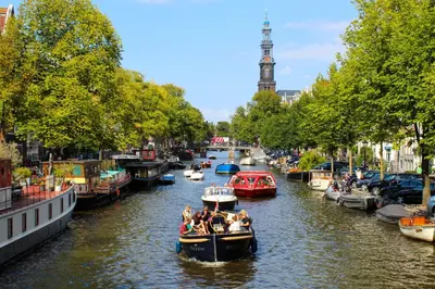 a group of people on a boat in a canal at Trendy 2 bedroom accommodation on perfect location in Amsterdam